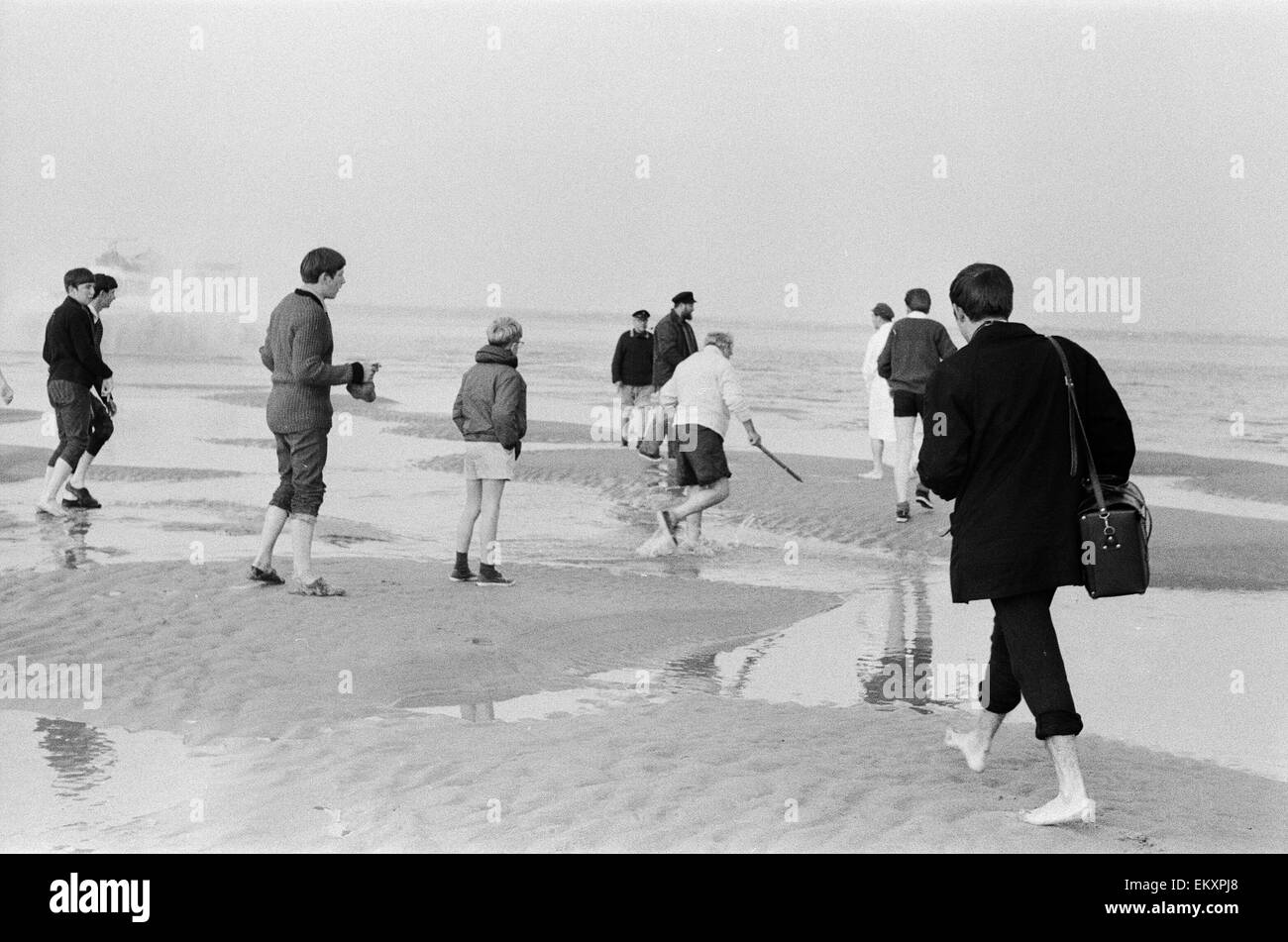 Brambles sandbank cricket match. 'Action' shots from the annual cricket match between the Royal Southern Yacht Club and the Island Sailing Club on a sandbank on the Isle of Wight. 18th September 1966 Stock Photo