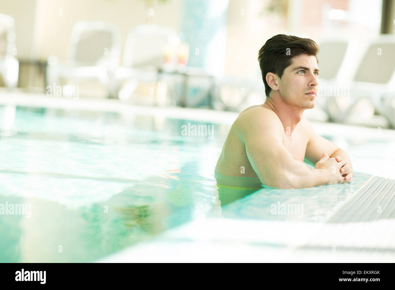 Young man in the swimming pool Stock Photo