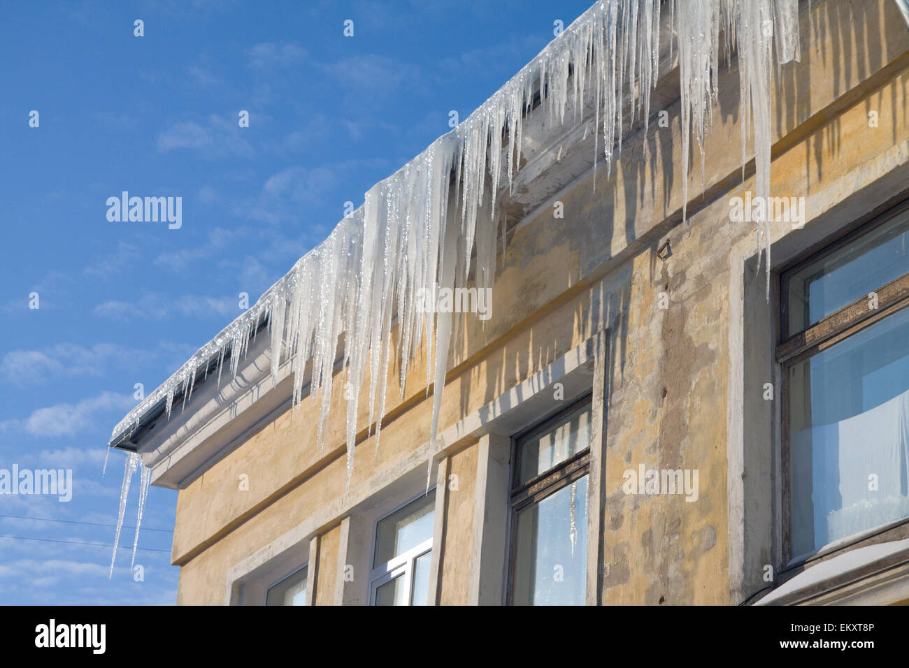 Icicles on a roof Stock Photo