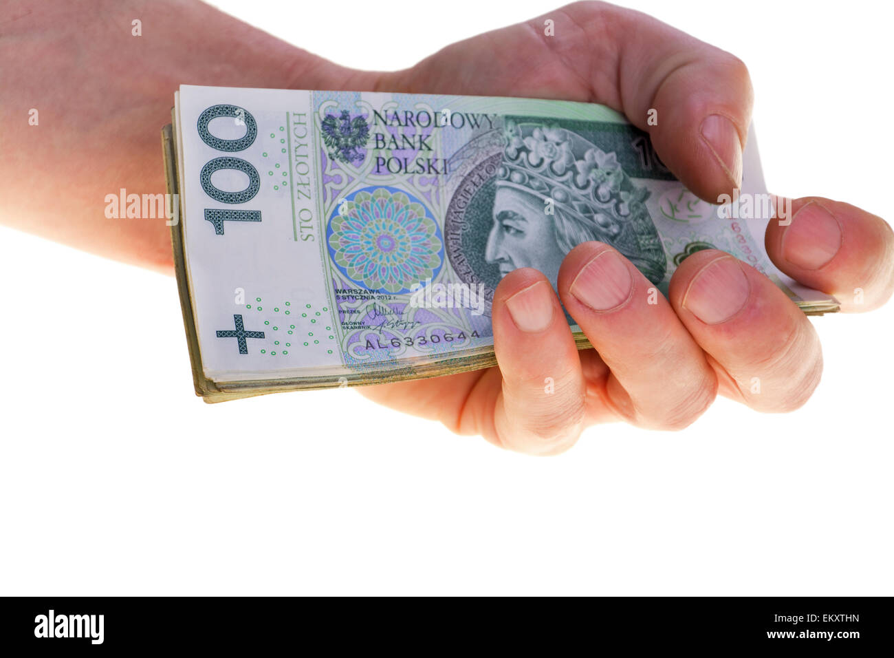 Polish currency banknotes hundred zloty stacked in hand. Stock Photo
