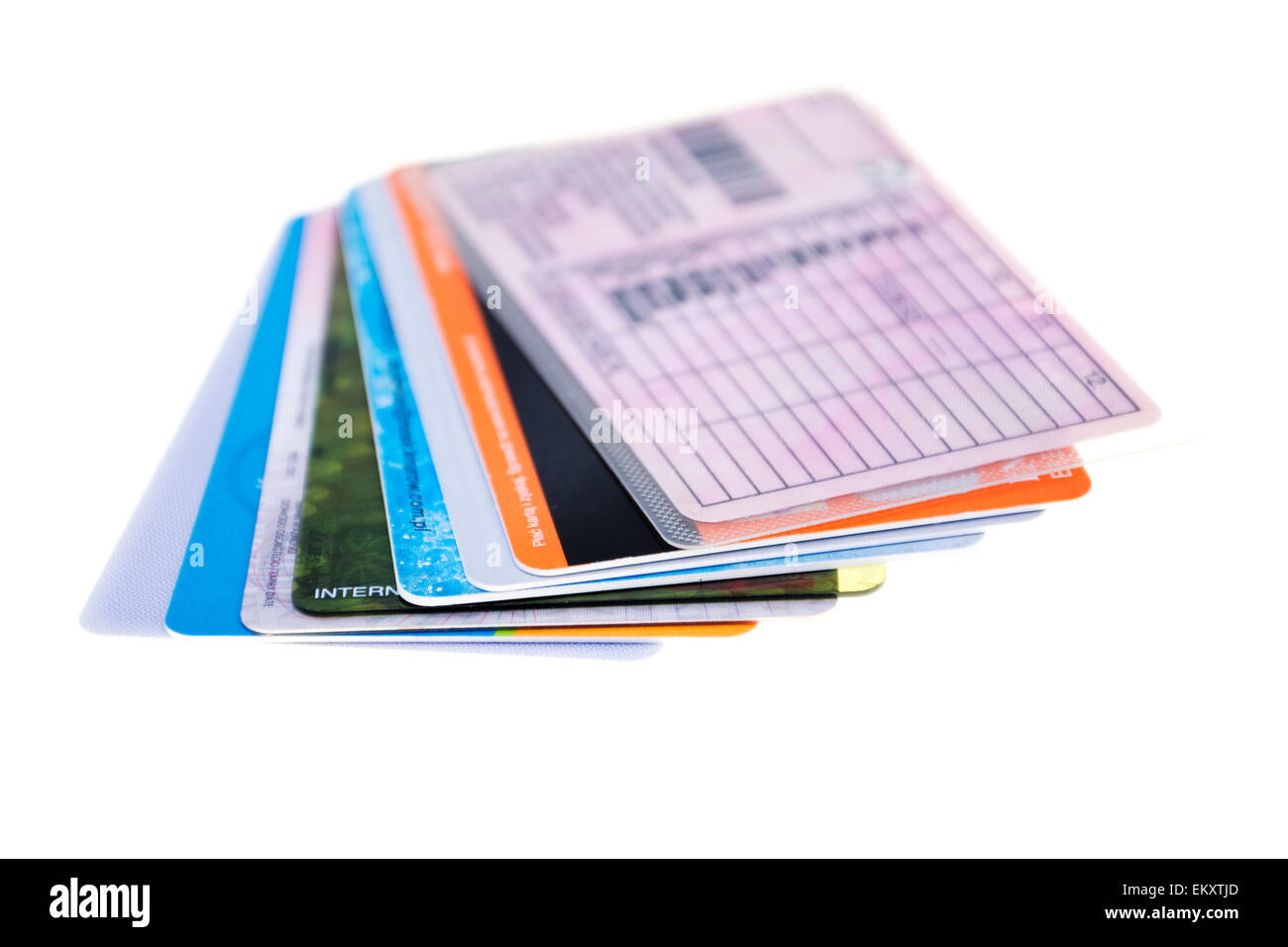 Credit cards arranged in a fan, isolated on white background, close-up Stock Photo