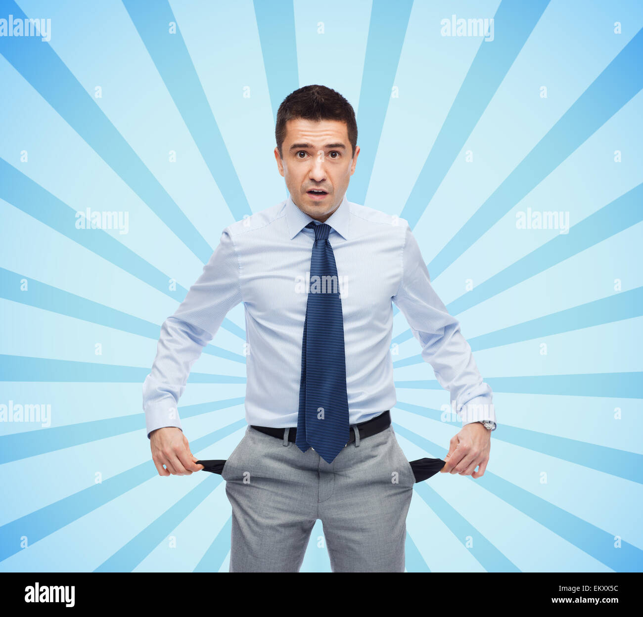 surprised businessman showing empty pockets Stock Photo Alamy