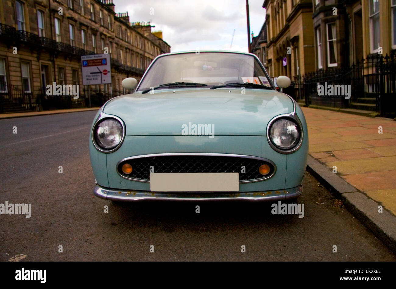 Old blue classic car parked on downtown of Edinburgh, Scotland Stock