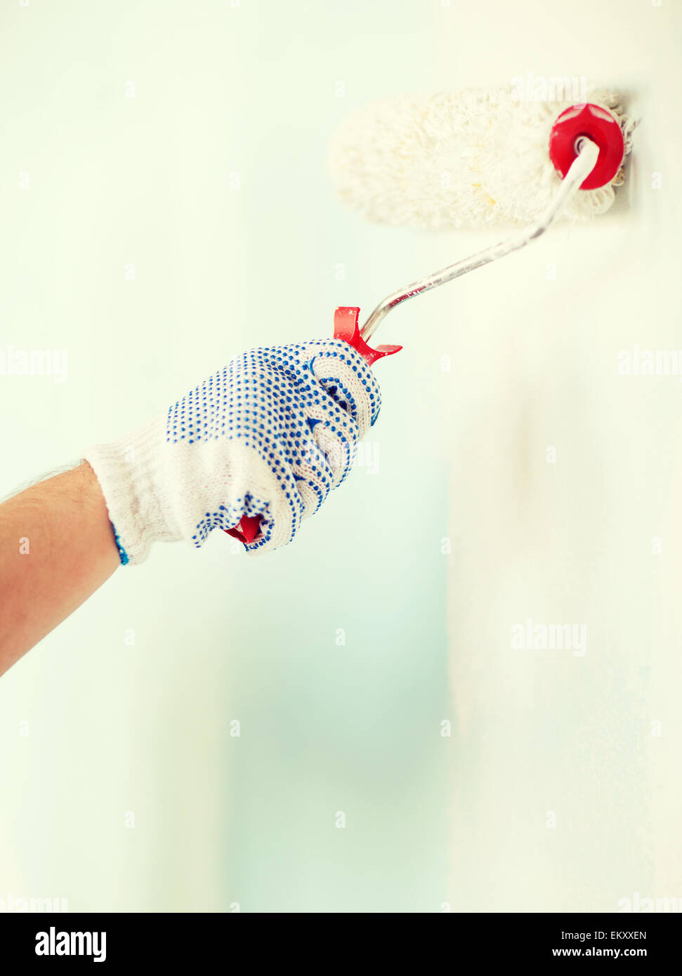 close up of male in gloves painting wall Stock Photo Alamy