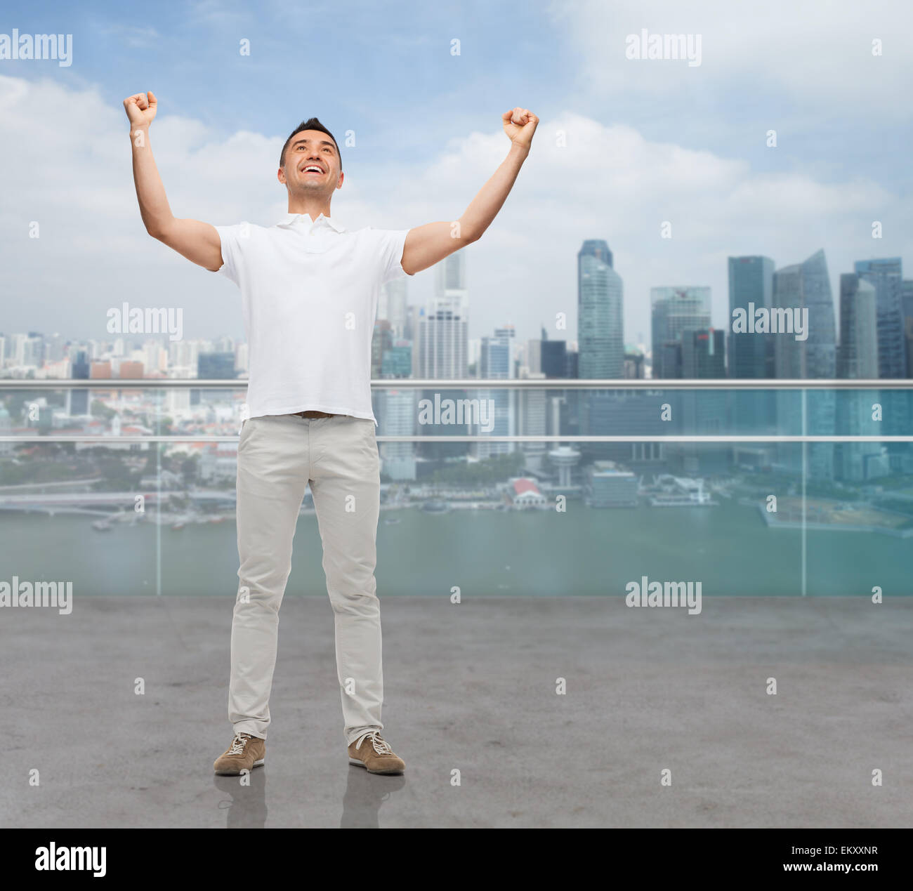 happy man with raised hands Stock Photo Alamy