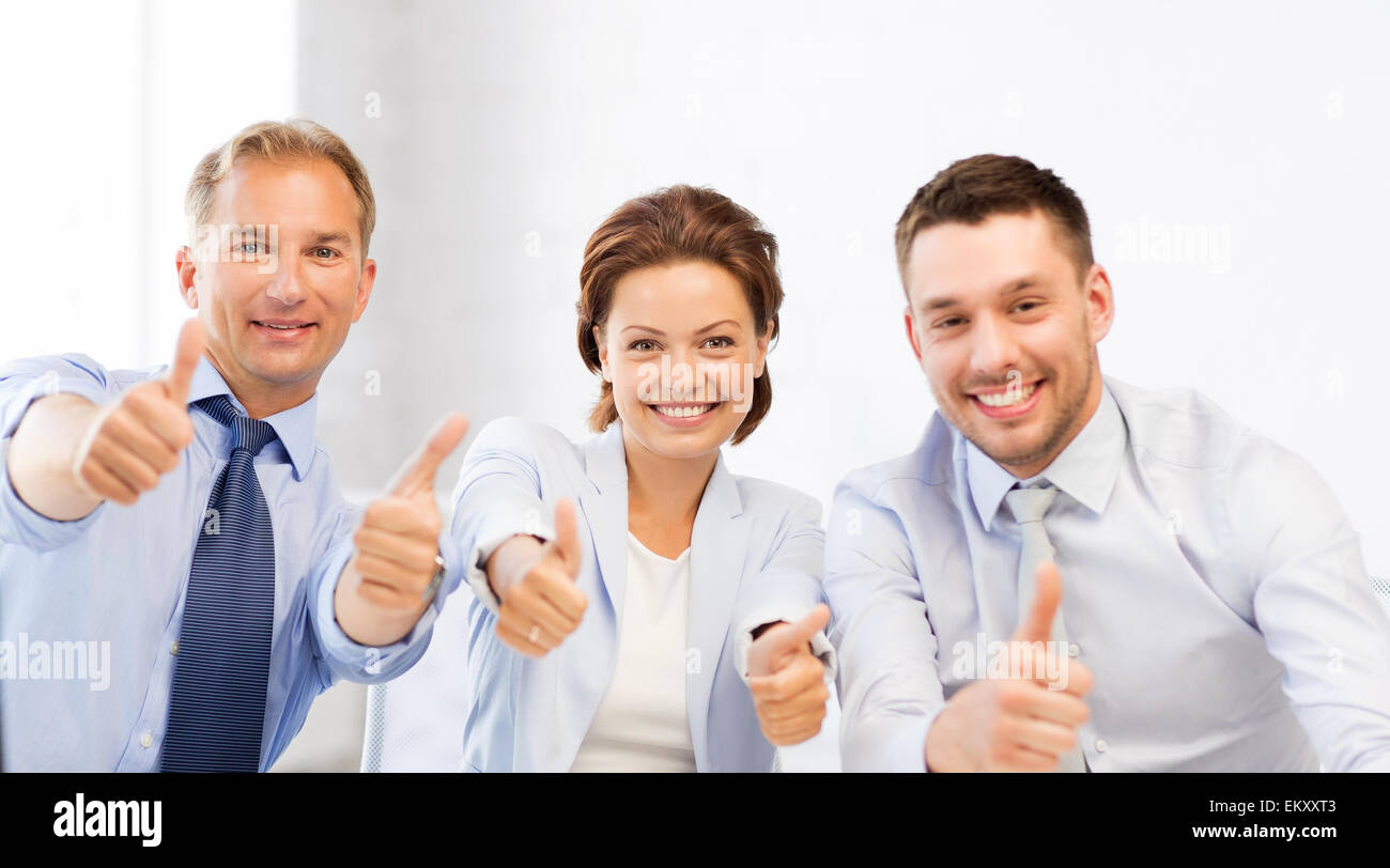 business team showing thumbs up in office Stock Photo - Alamy