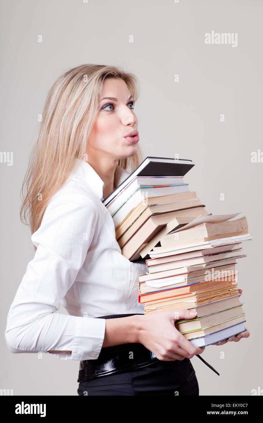 girl holding a stack of books Stock Photo - Alamy