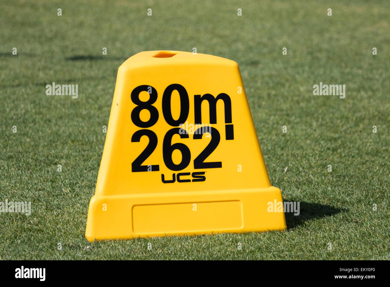 Track and field throwing Distance marker in feet and meters Stock Photo