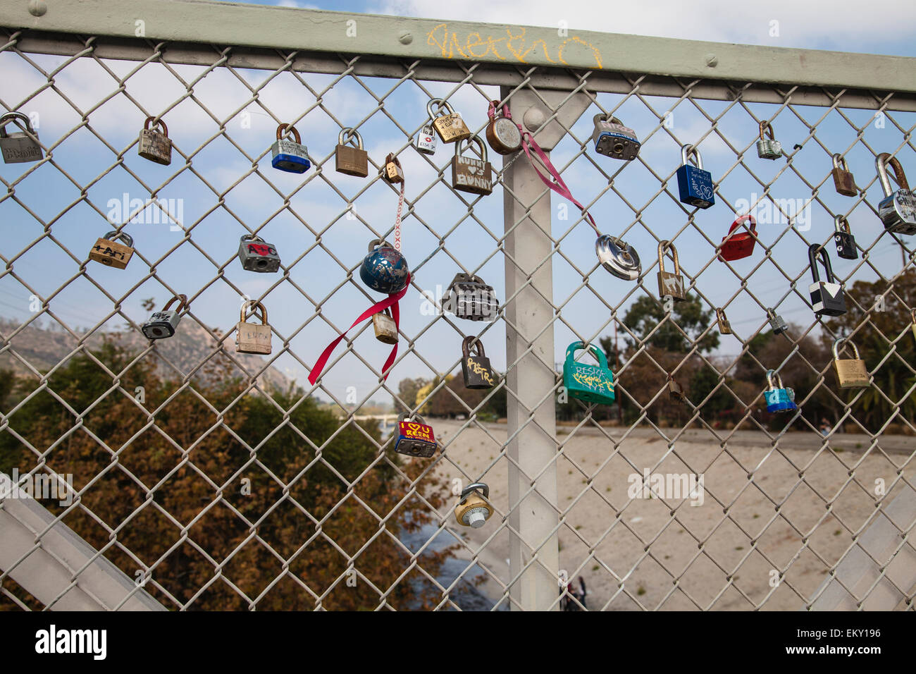 Love Locks adorn the Sunnynook Pedestrian Bridge over the Los Angeles River along the Glendale Narrows Stock Photo