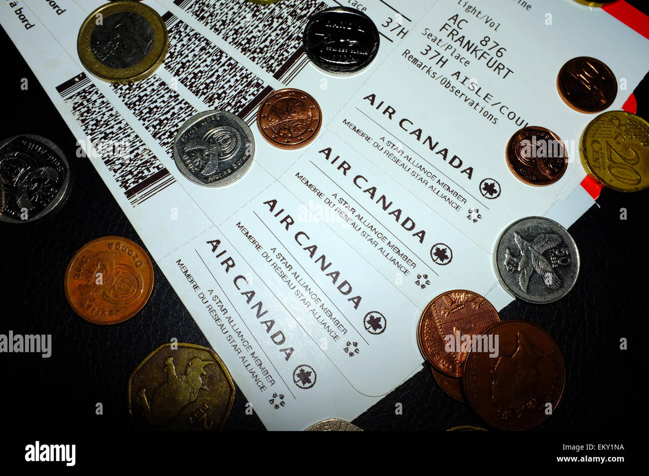 Air Canada boarding passes photographed against a black background with