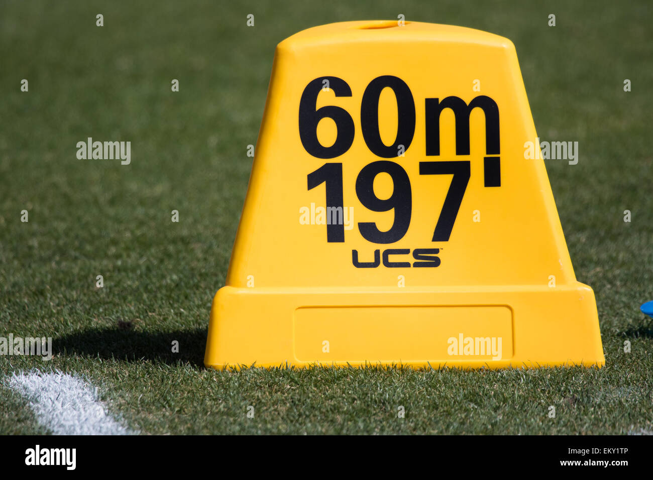 Track and field throwing Distance marker in feet and meters Stock Photo -  Alamy