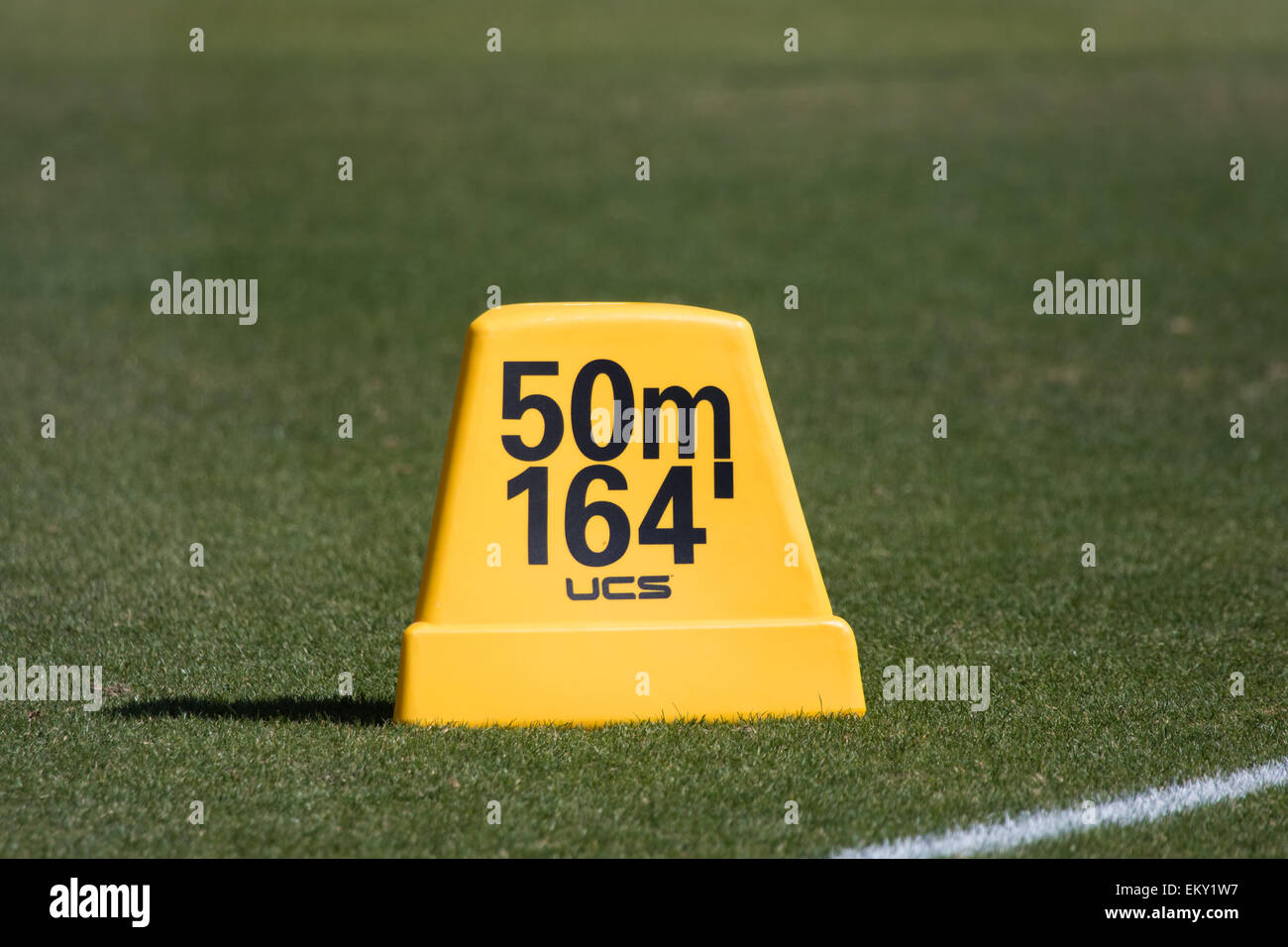 Track and field throwing Distance marker in feet and meters Stock Photo