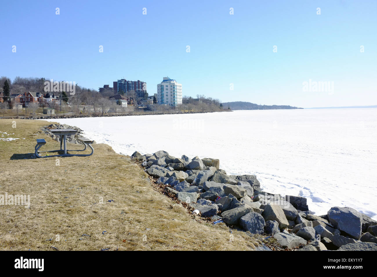 Rocks on the side of a frozen Lake Simcoe on the edge of Barrie in Ontario. Stock Photo