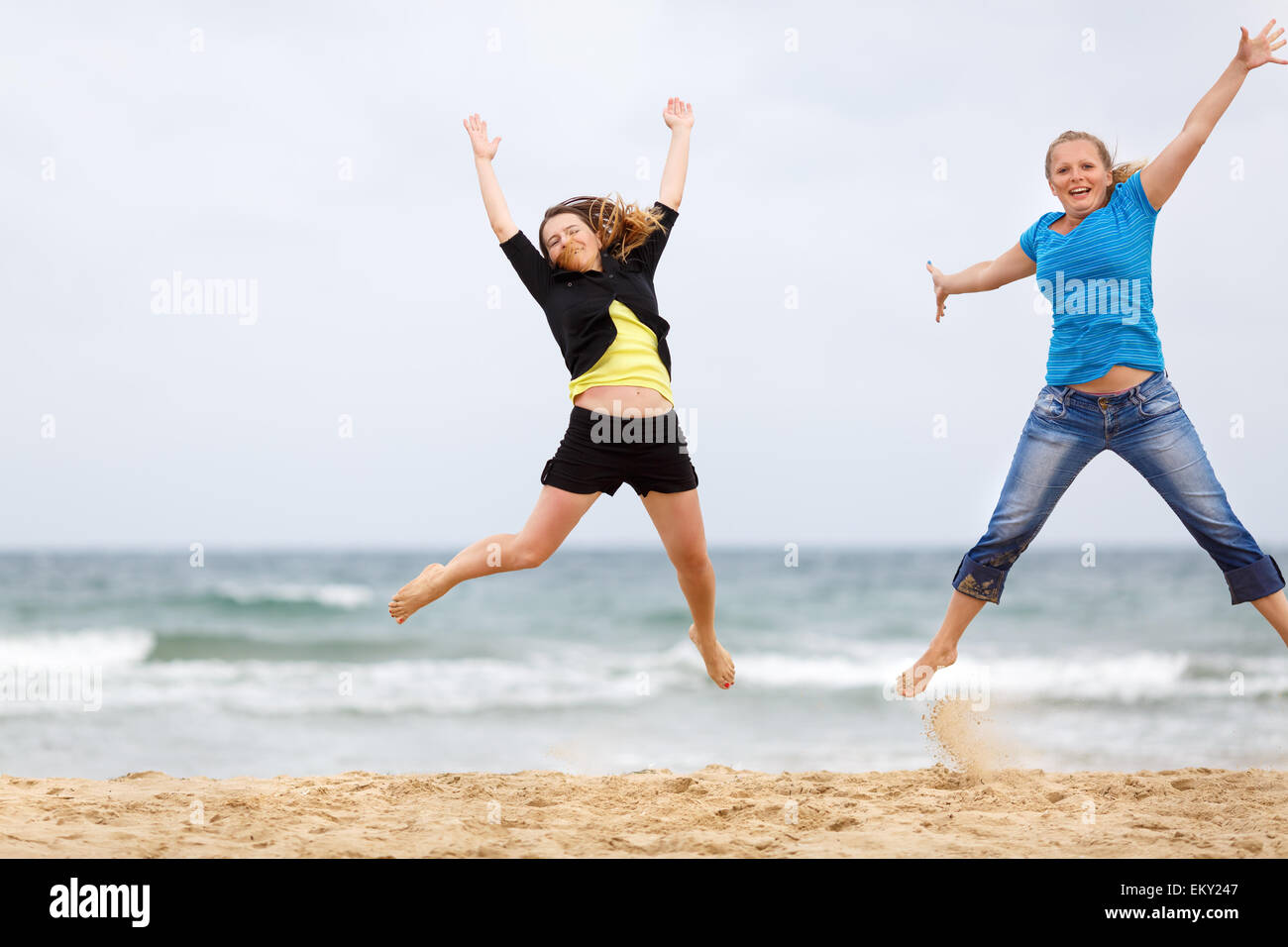 Happy women jumping hi-res stock photography and images - Alamy