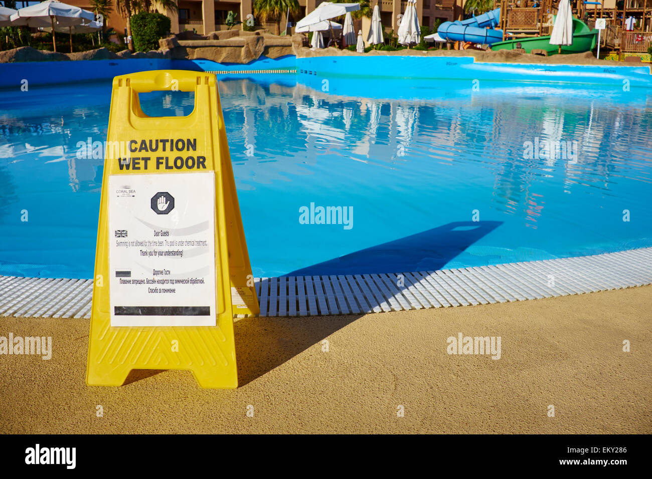 Caution Wet Floor Sign With A Note To Say The Pool Is Closed Coral