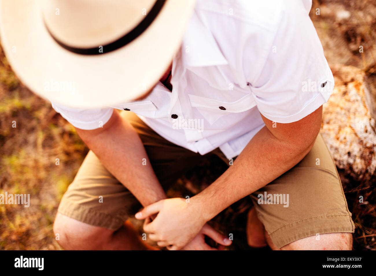 unidentified man in hat dreaming on vacation  top view Stock Photo