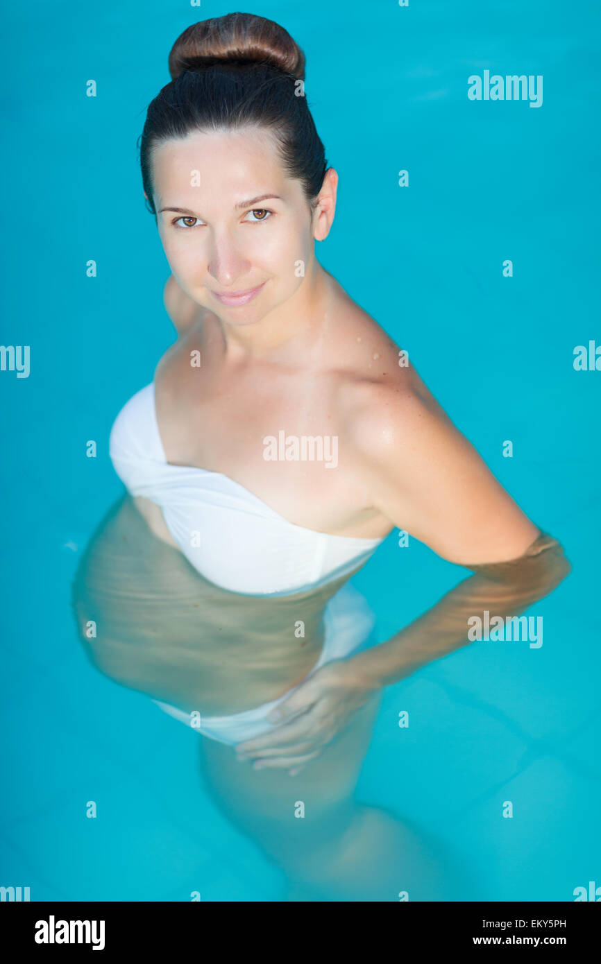 Pregnant Woman Standing in Water Bathing Outdoor Stock Image