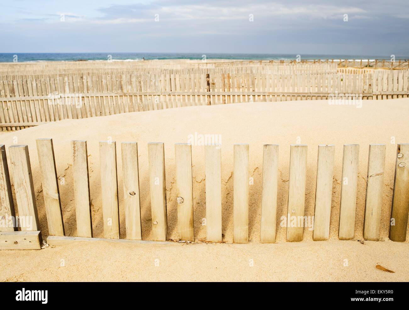 Wooden Fences On The Beach, Cadiz, Spain Stock Photo