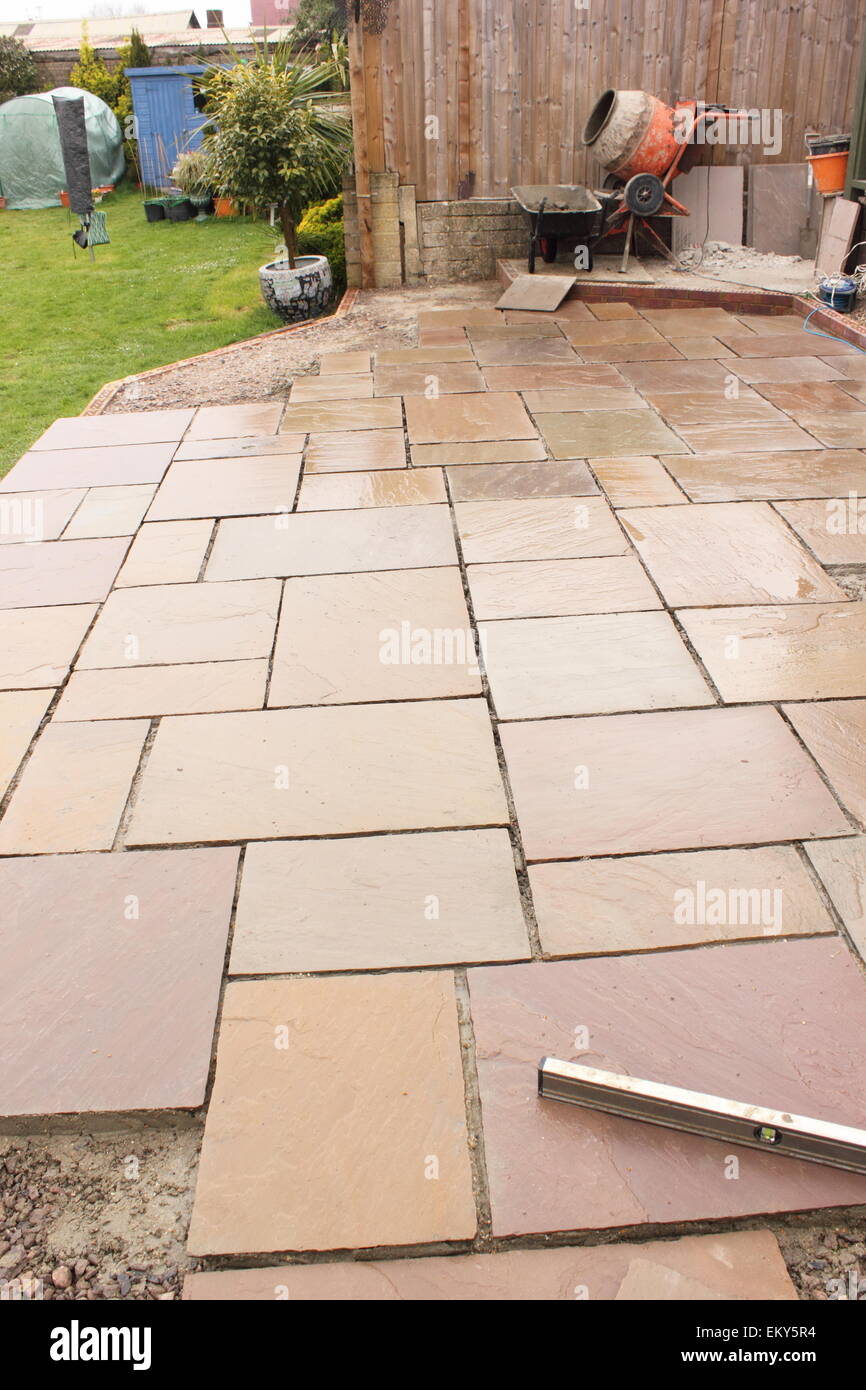 The construction and Building of a natural stone patio Stock Photo Alamy