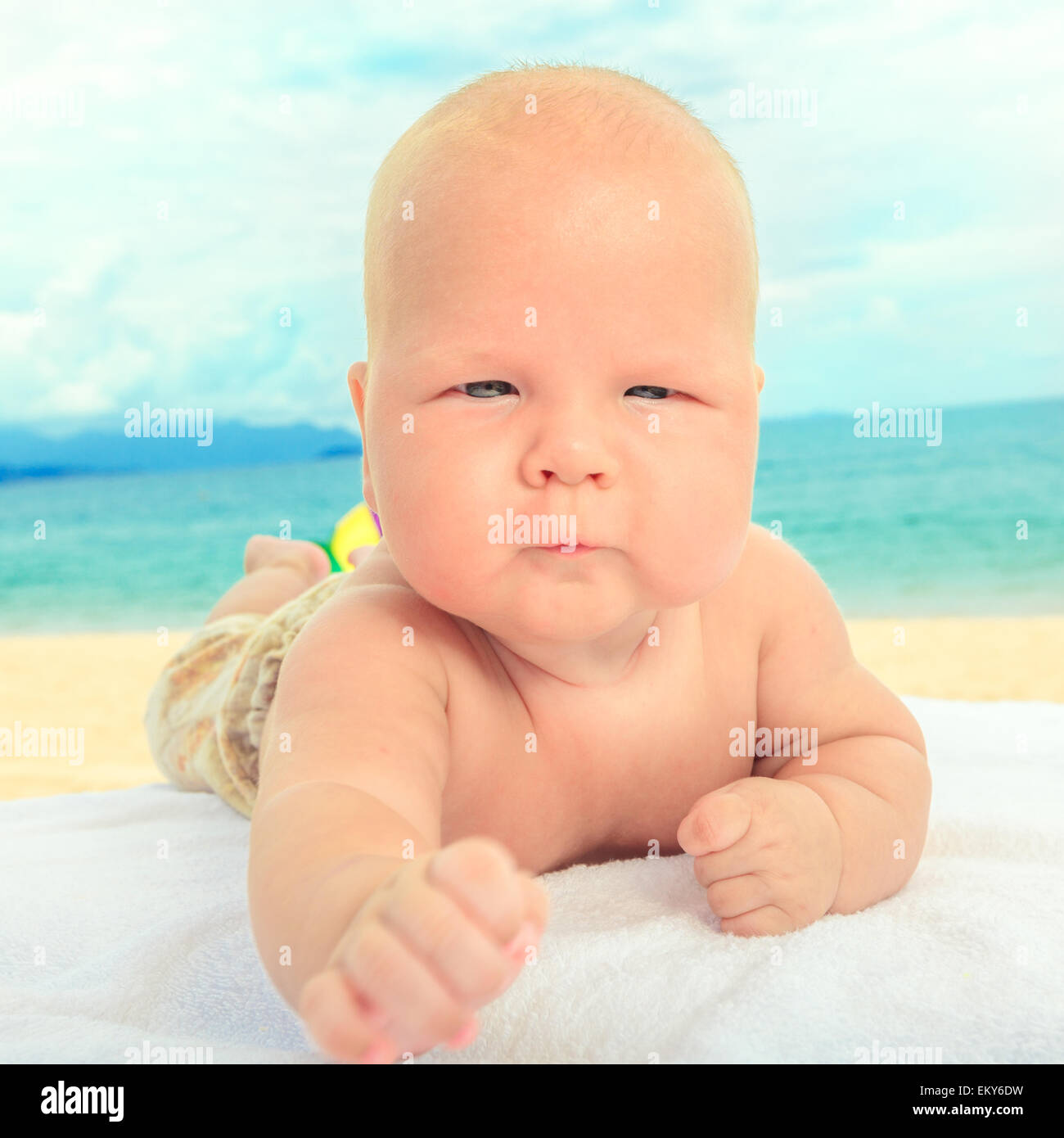 Cute baby laying on the sunbed at the beach Stock Photo Alamy