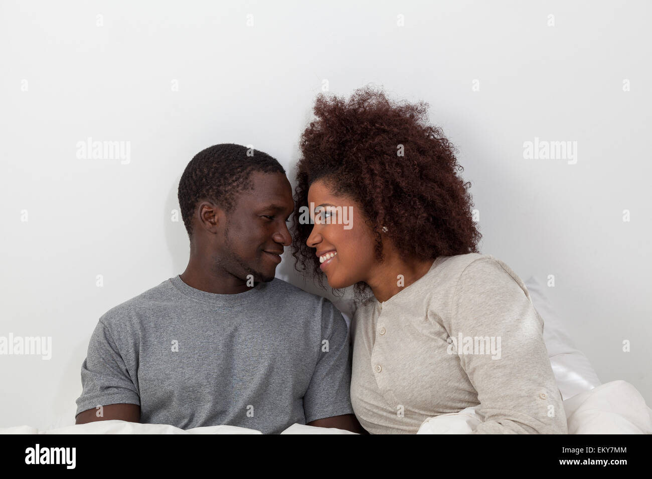 African couple in love on the bed Stock Photo - Alamy