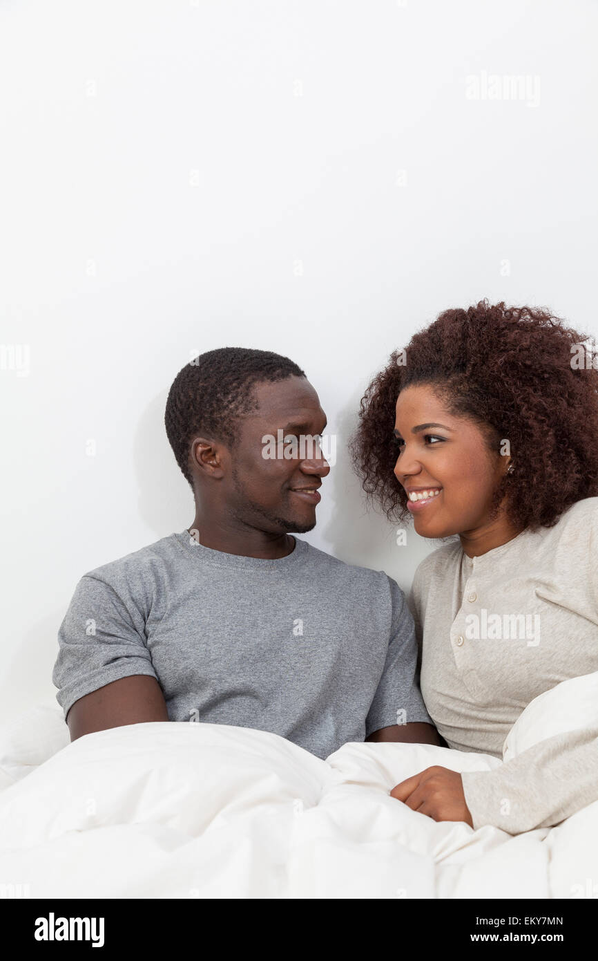 African couple in love on the bed Stock Photo - Alamy