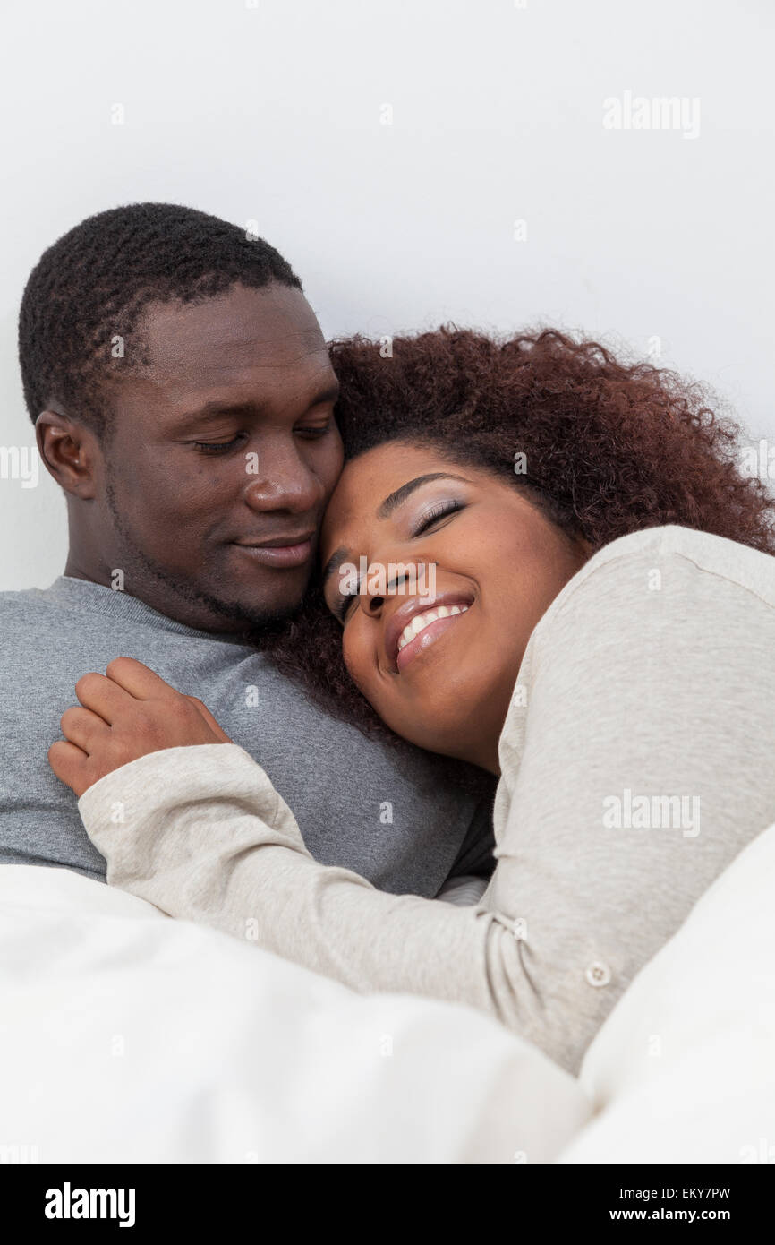 African couple in love on the bed Stock Photo - Alamy