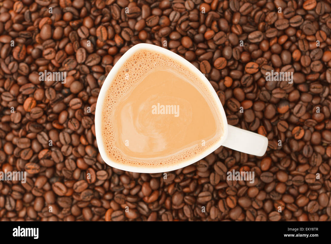 Cup of coffee with milk on coffee beans background Stock Photo - Alamy