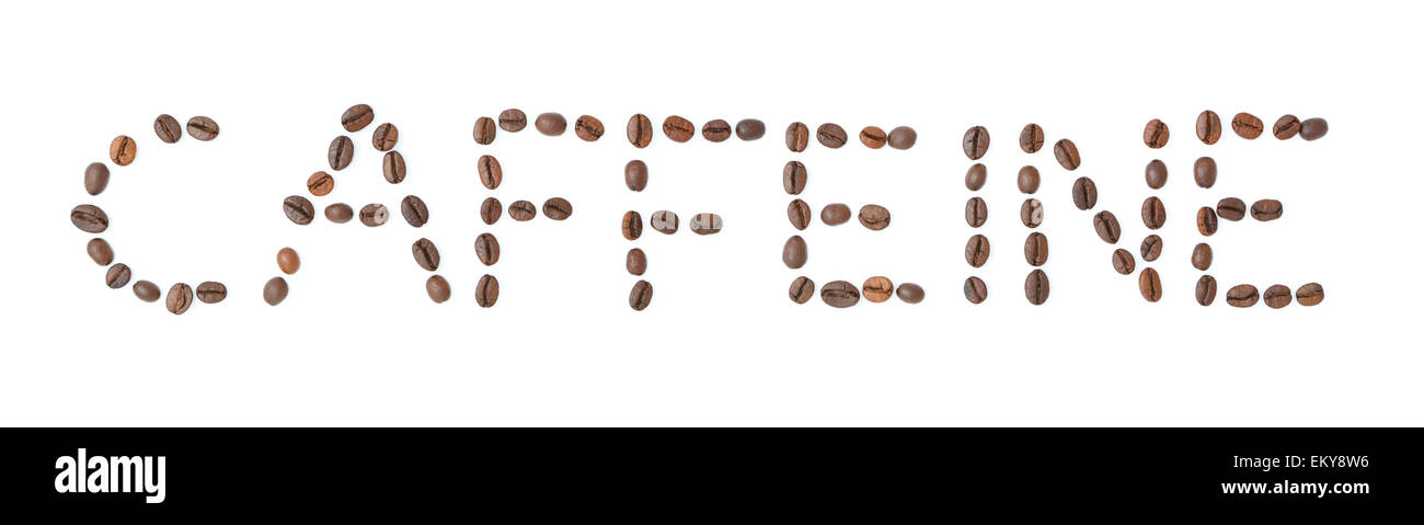 Writing CAFFEINE made of coffee beans isolated on white background studio shot Stock Photo