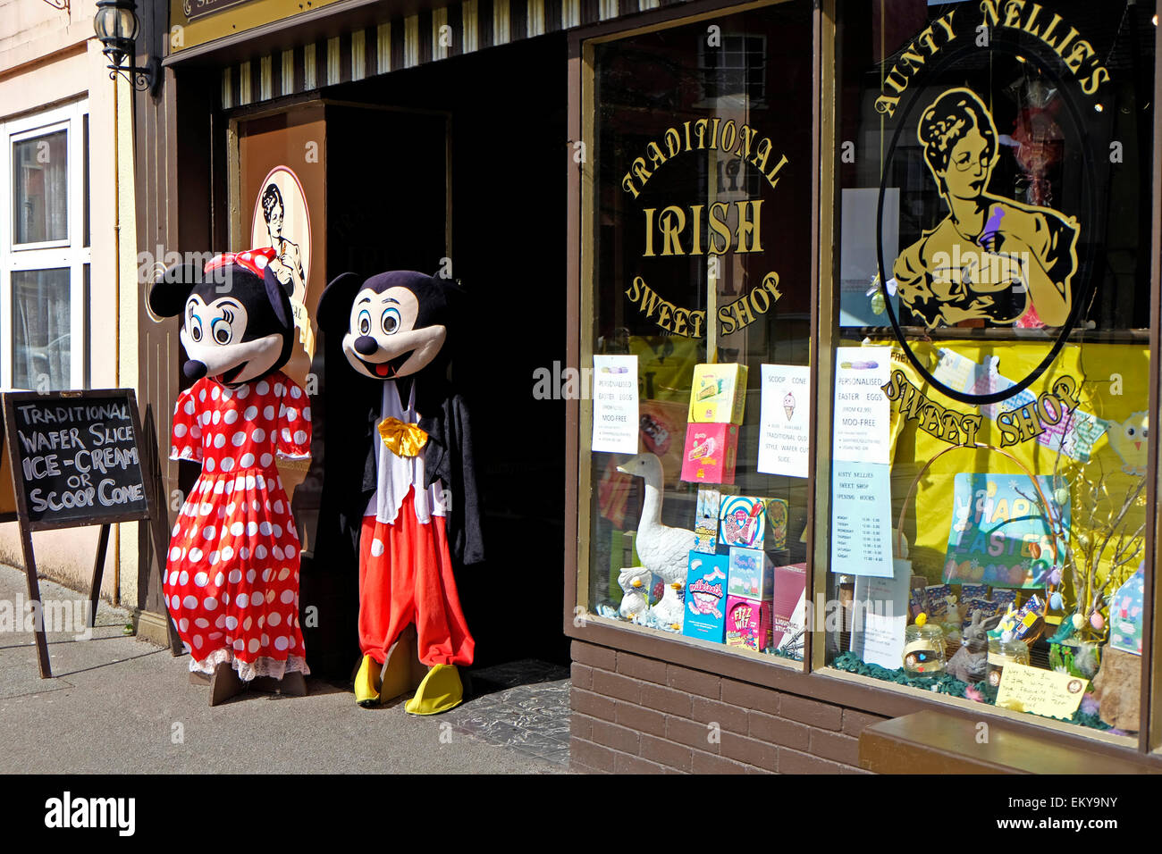Old fashioned sweet shop in Clonakilty town in West Cork Ireland, with two Disney figures outside Stock Photo