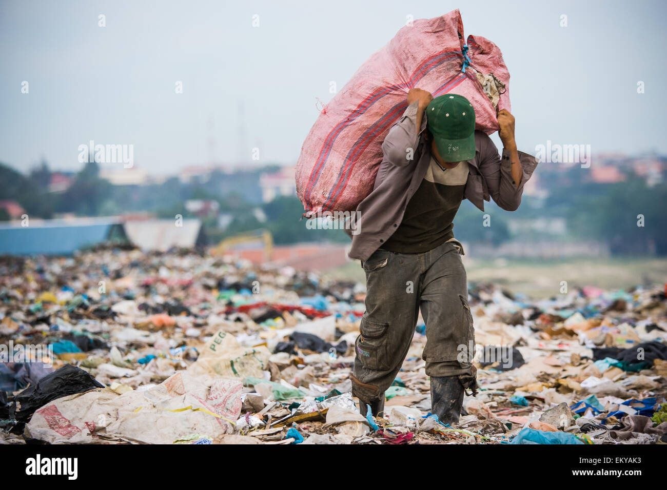 Cambodia, Boy working at city trash dump; Phnom Penh Stock Photo