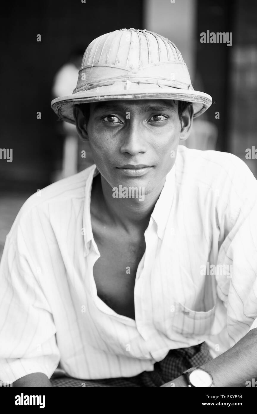 Burma, Man with Ghurkha hat; Rangoon Stock Photo