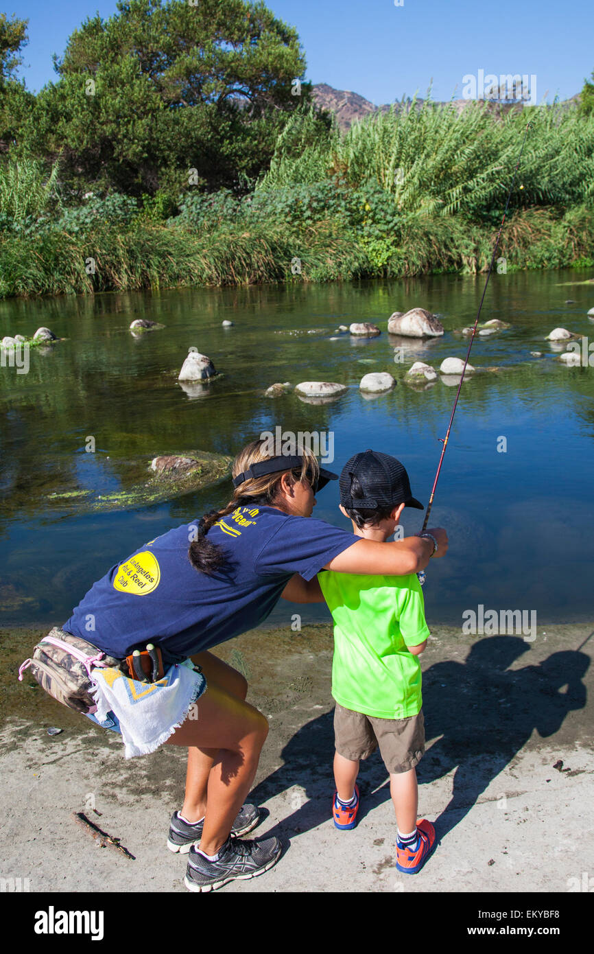 Caucasian mother and daughter fly fishing Stock Photo - Alamy