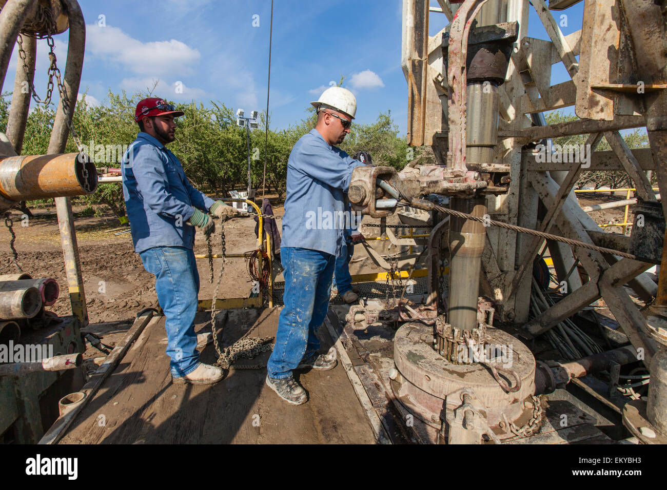 Water well being drilled in Almond orchard. Tulare County, San Joaquin Valley, California, USA Stock Photo