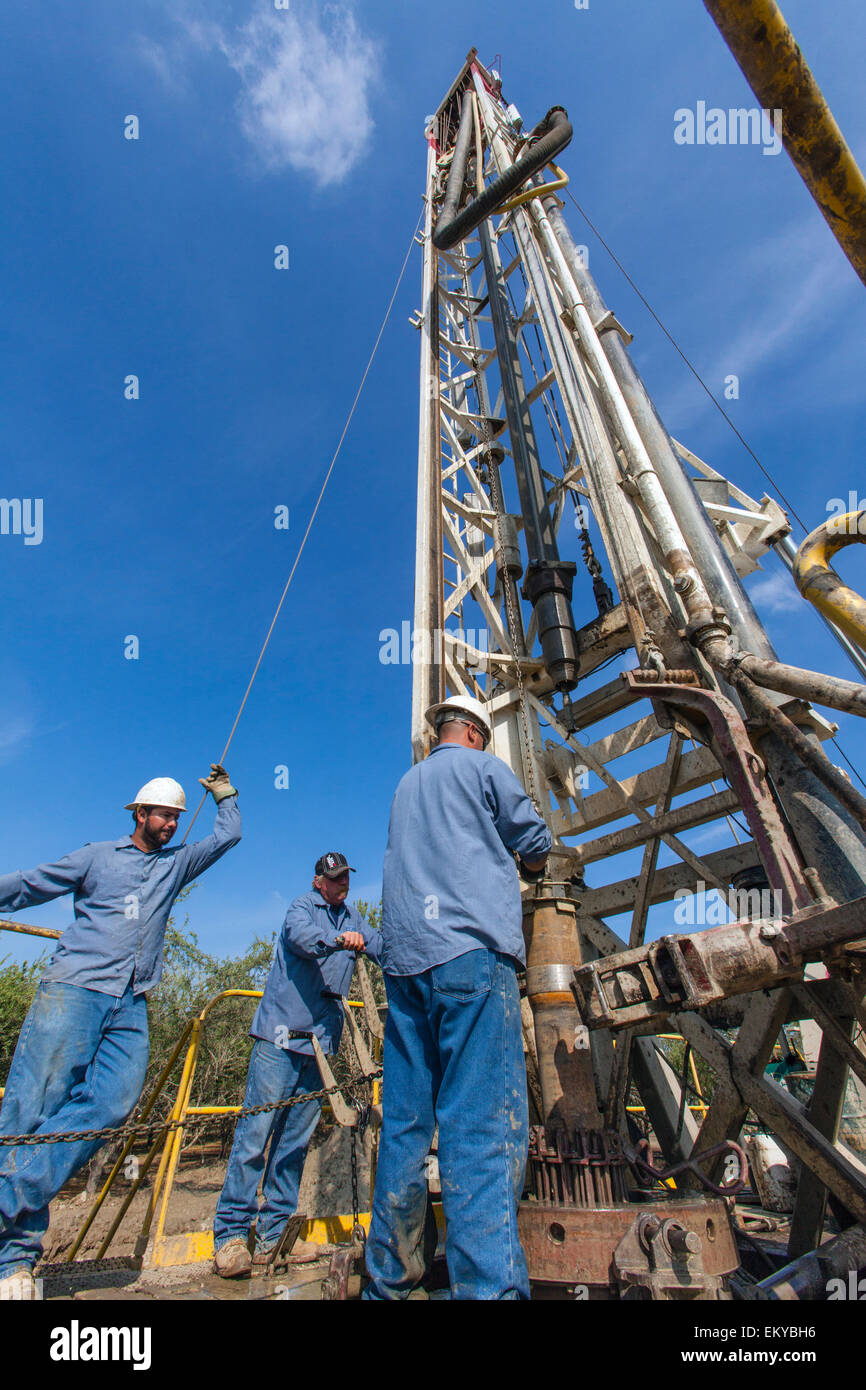 Water well being drilled in Almond orchard. Tulare County, San Joaquin Valley, California, USA Stock Photo