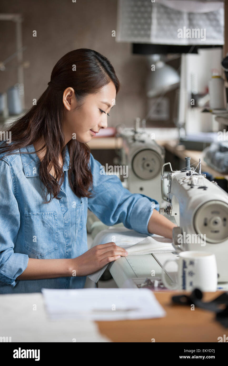 Focused woman sewing machine in hi-res stock photography and images - Alamy