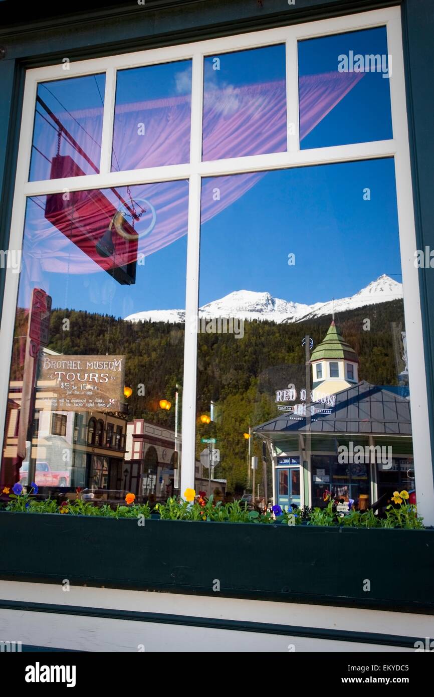 Skagway, Alaska, USA; Reflection In The Window Of The Red Onion Saloon In Klondike Gold Rush National Historic Park Stock Photo