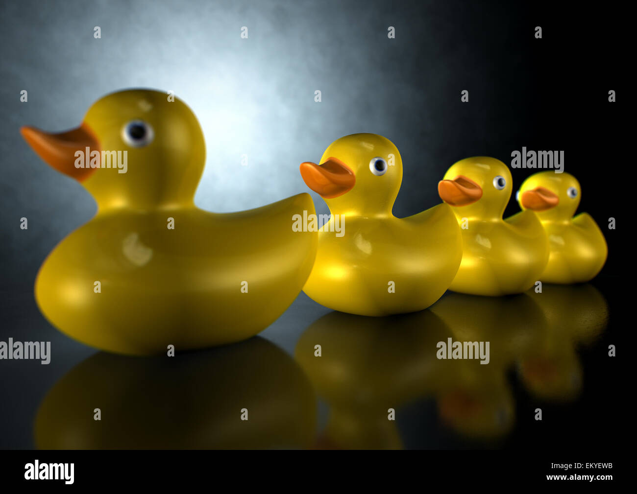 A row of organised and ready yellow rubber bath duck toys on an ...