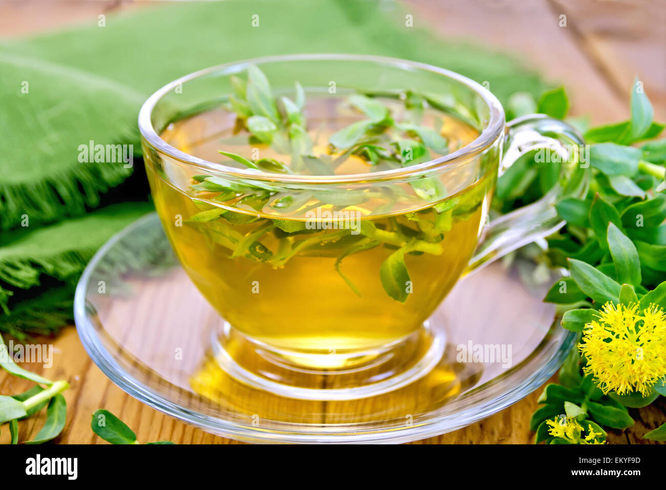 Herbal tea with Rhodiola rosea and napkin on board Stock Photo