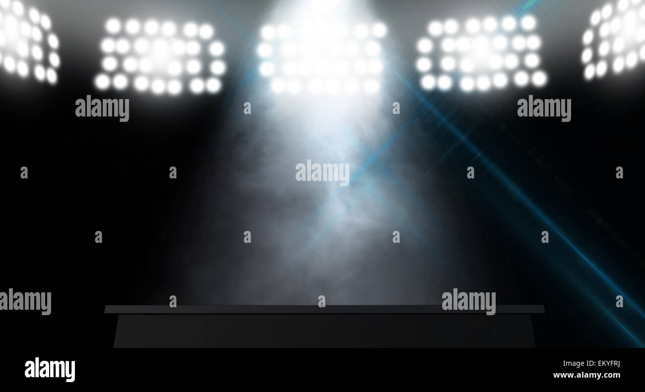 An stage lit by a single spotlight on a dark background Stock Photo - Alamy