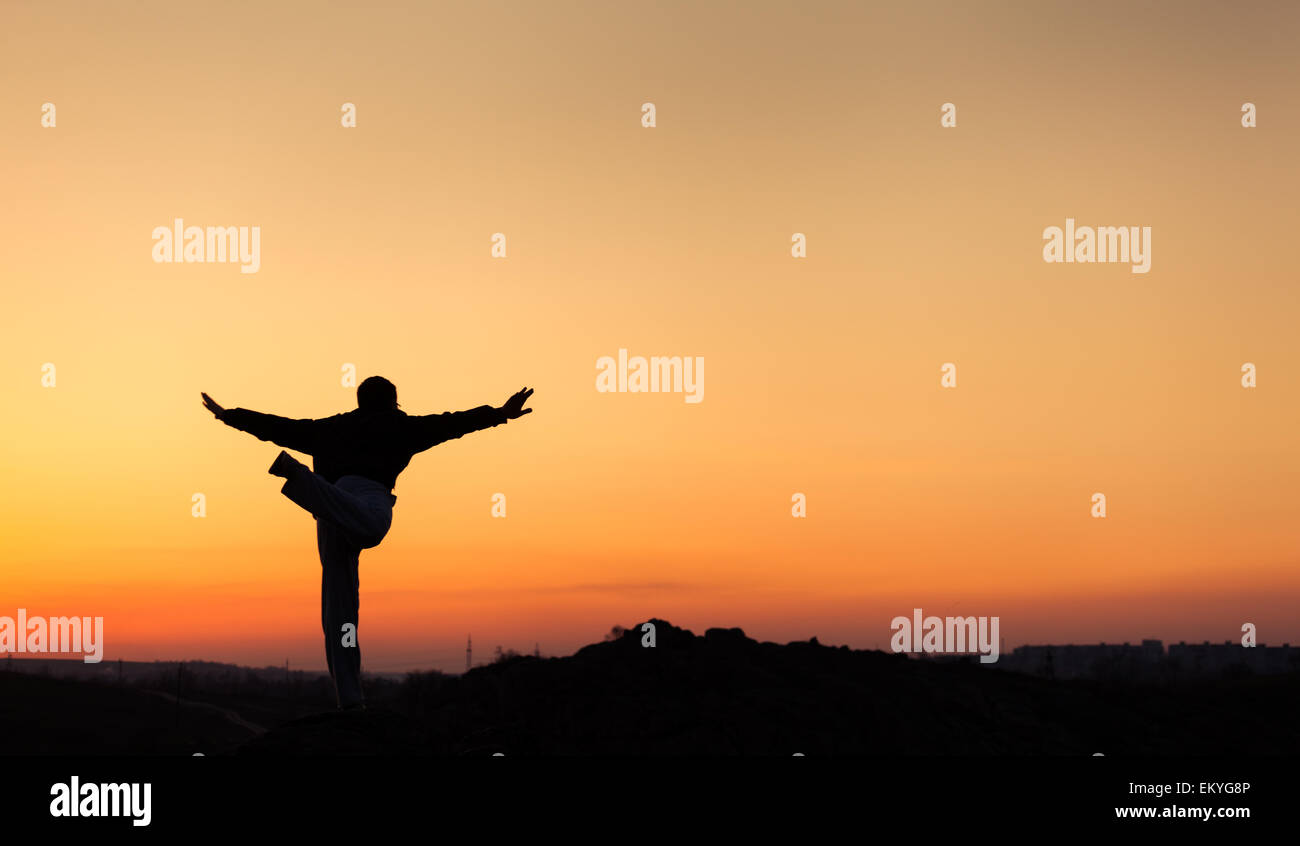 Silhouette of man and beautiful sky. Element of design. Summer sunset. Background Stock Photo