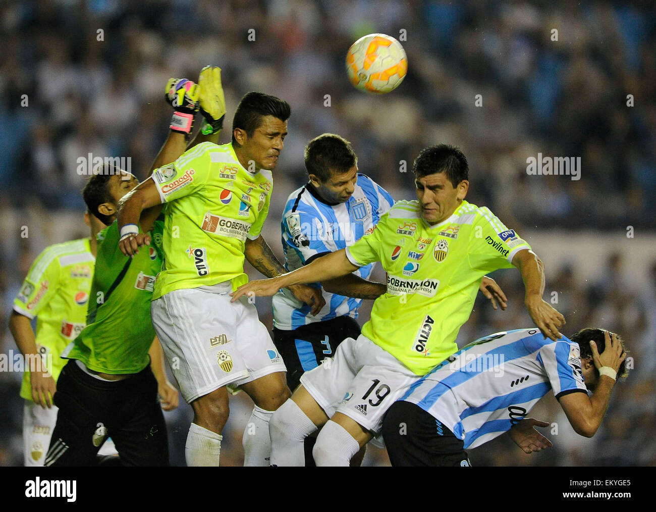 Buenos Aires, Argentina. 14th Apr, 2015. Racing Club's Leandro Grimi (C) of Argentina, vies for the ball with Deportivo Tachira's Carlos Javier Lopez (2-R) of Venezuela, during the match of Copa Libertadores in the Presidente Peron Stadium, in Buenos Aires, Argentina, on April 14, 2015. Credit:  Fernando Gens/TELAM/Xinhua/Alamy Live News Stock Photo