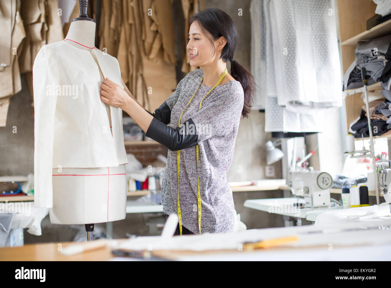 Fashion designer working in studio Stock Photo - Alamy