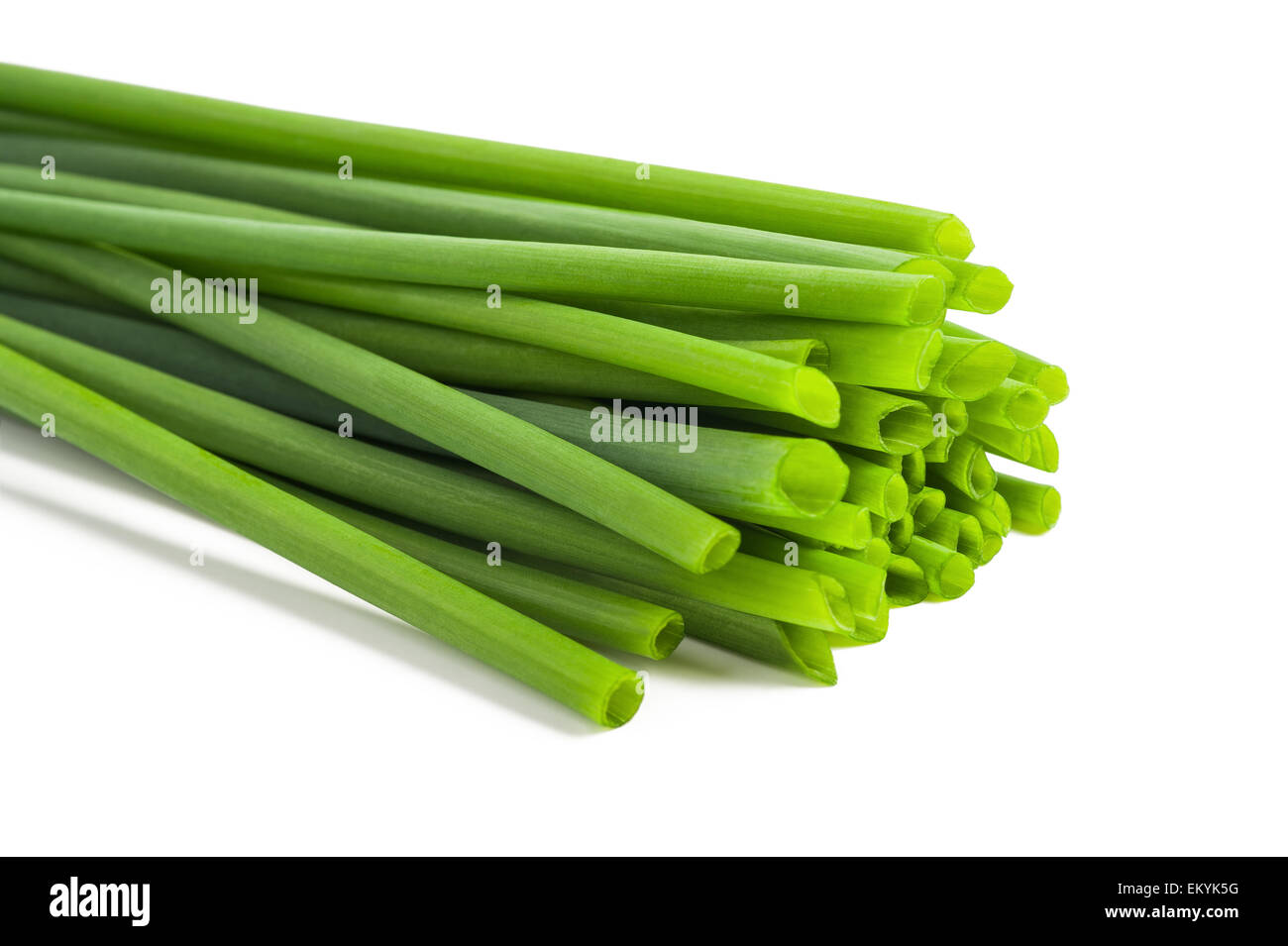 Bunch of chives on white background Stock Photo - Alamy