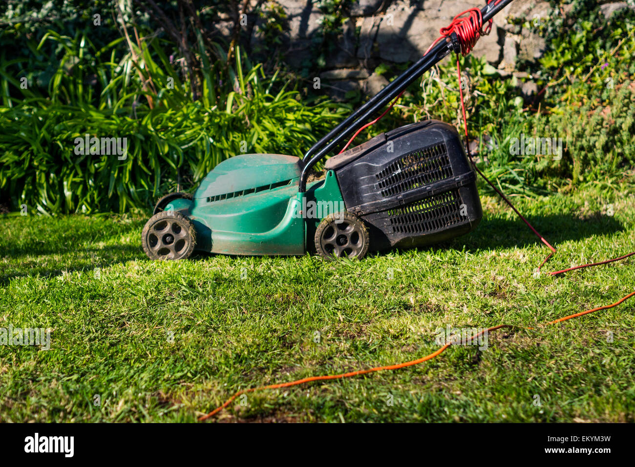 Side on view of electric lawn mower Stock Photo
