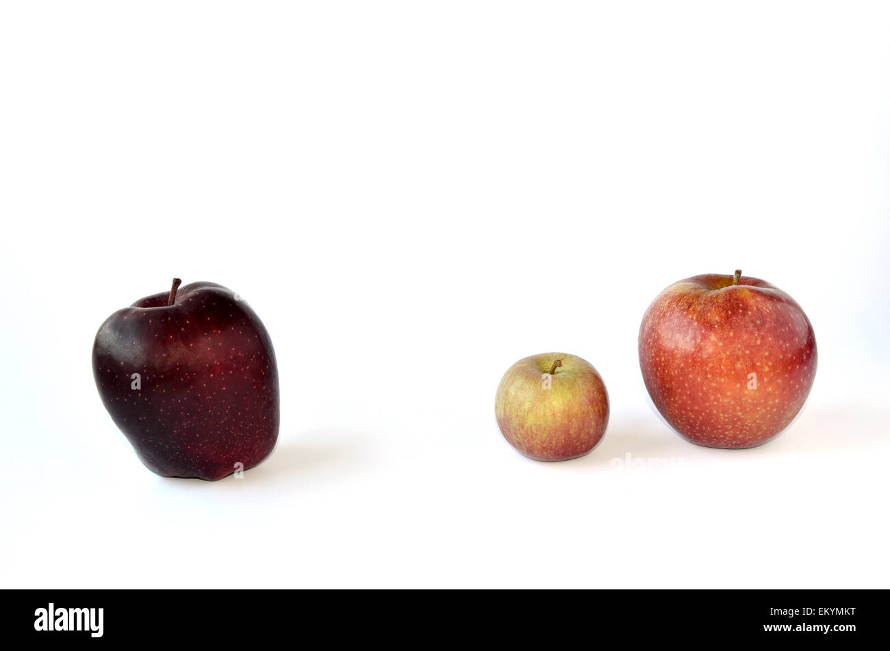 Three apples - two against bully Stock Photo
