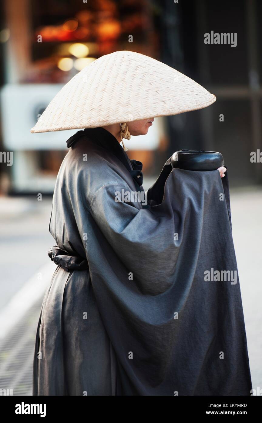 A Woman In A Robe And Conical Hat On Teapot Lane; Kyoto, Japan Stock