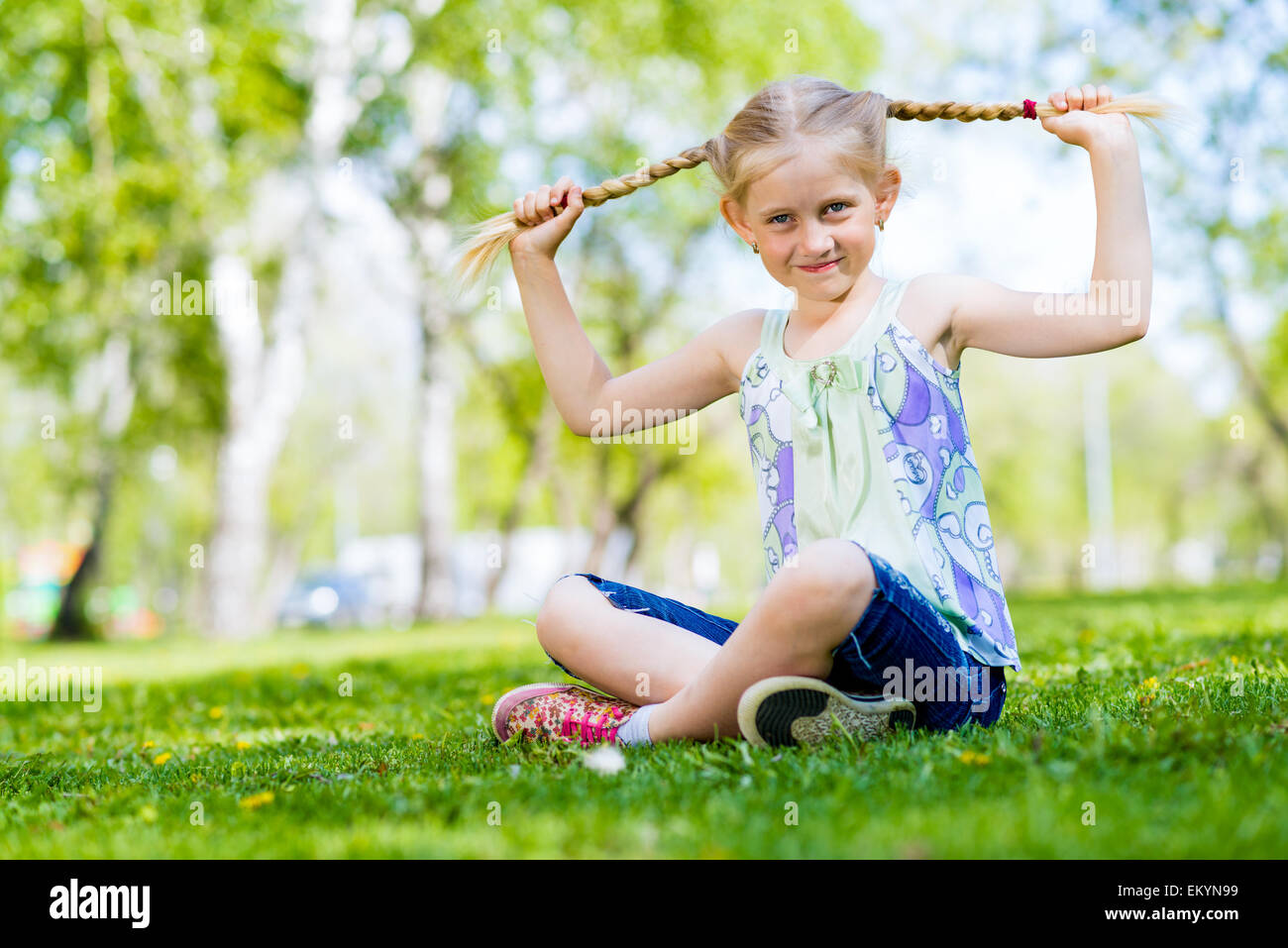 portrait of a girl in a park Stock Photo - Alamy