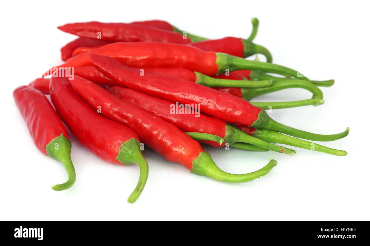 Red chili peppers over white background Stock Photo - Alamy