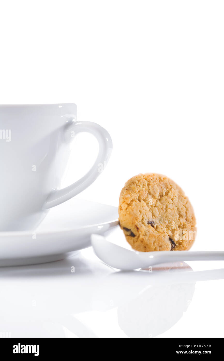 cup and spoon with cookie isolated Stock Photo Alamy
